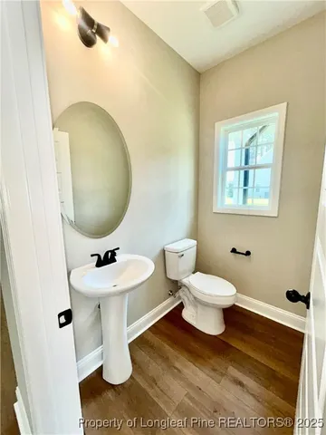 a view of kitchen with cabinets and wooden floor