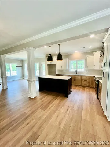 a kitchen with stainless steel appliances granite countertop a sink counter space and cabinets