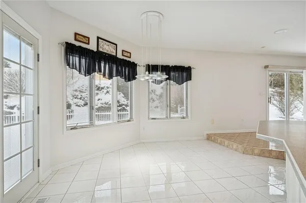 a view of a livingroom with wooden floor and fireplace