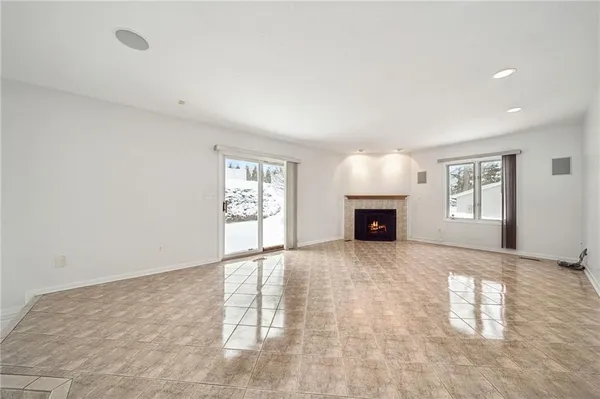 an empty room with closet and a bathroom