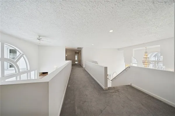 a spacious bathroom with a shower sink vanity mirror and toilet