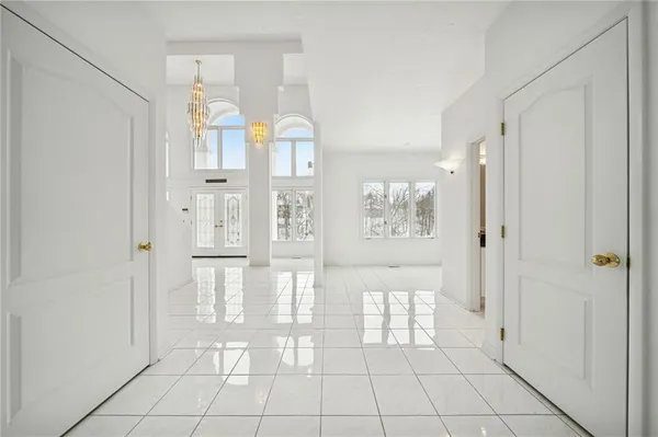 a view of a bathroom with white walls