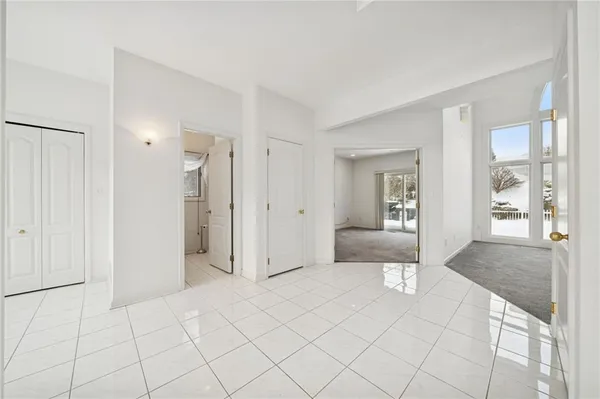 a view of a bathroom with tub and shower