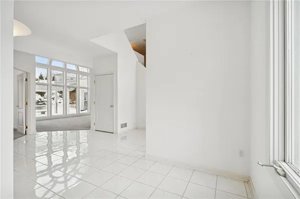 a view of an empty room and window