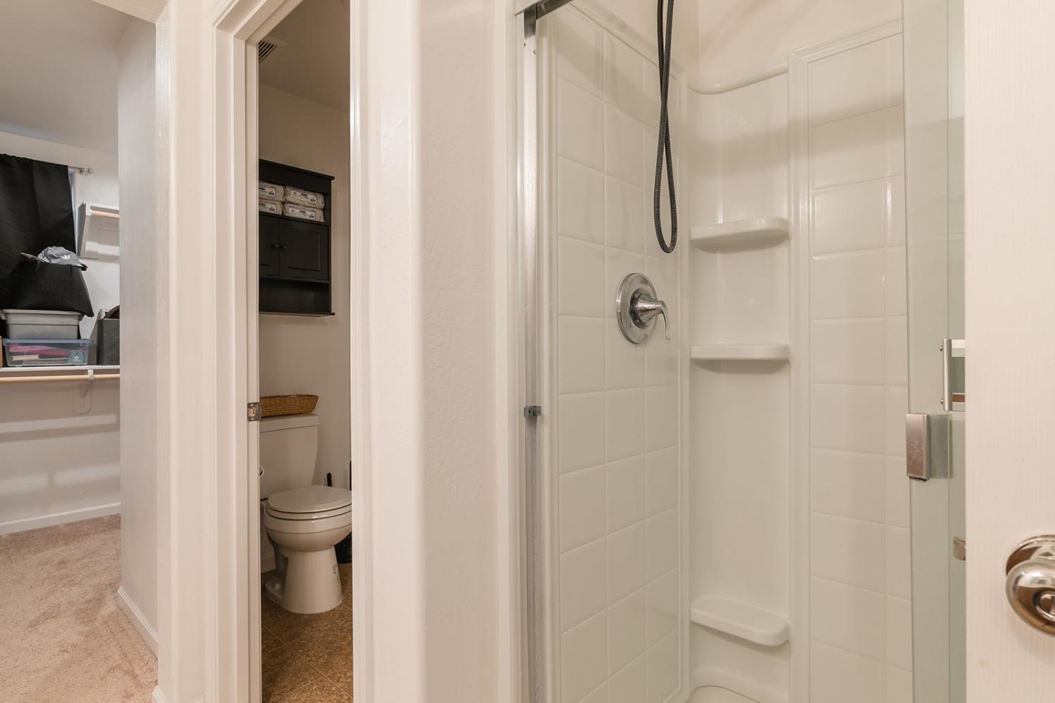 1945 East Gum Avenue Reedley, CA 93654 - Photo 17 of 31 a bathroom with a shower