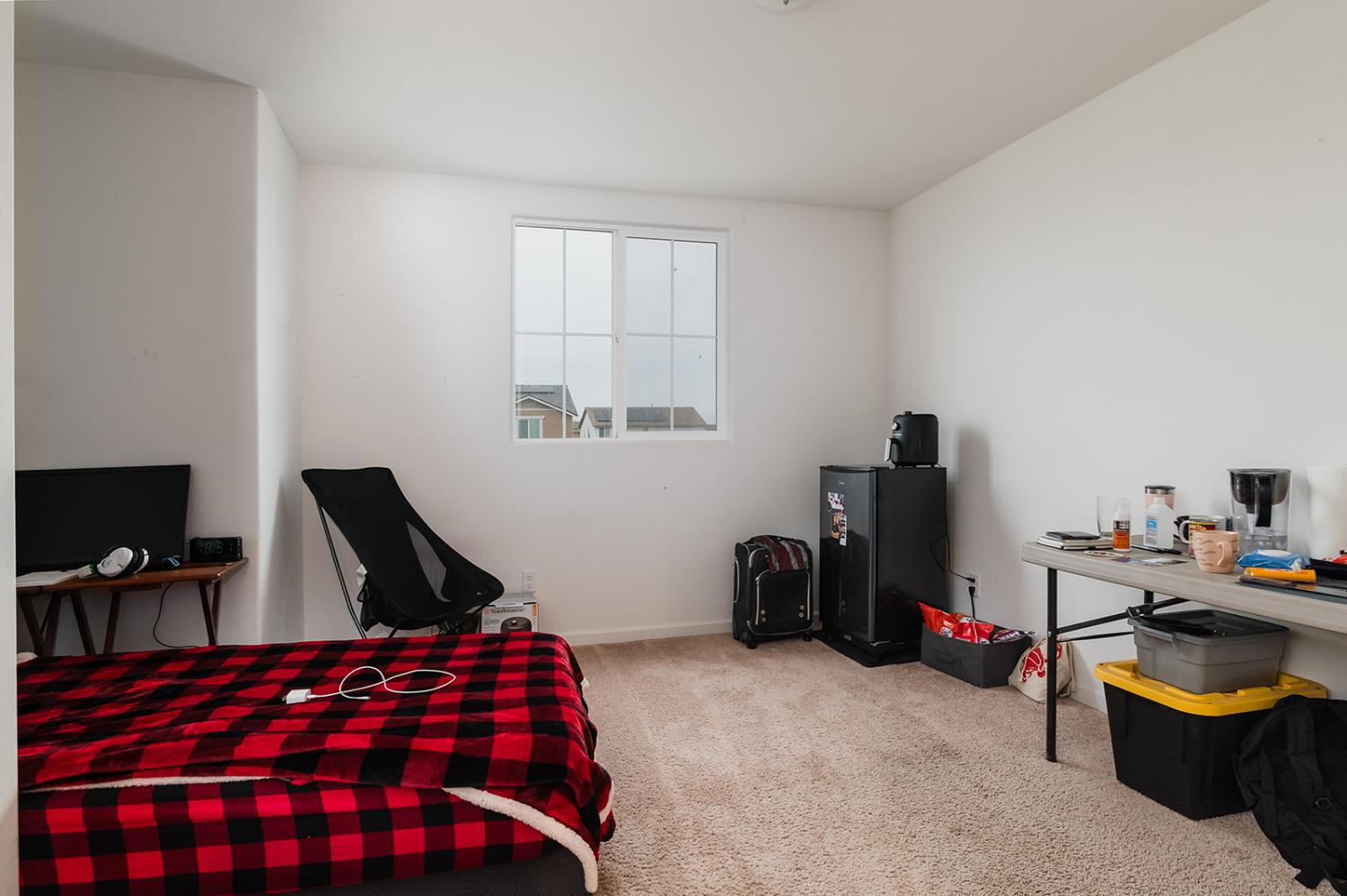 1945 East Gum Avenue Reedley, CA 93654 - Photo 19 of 31 a bedroom with furniture and a flat screen tv