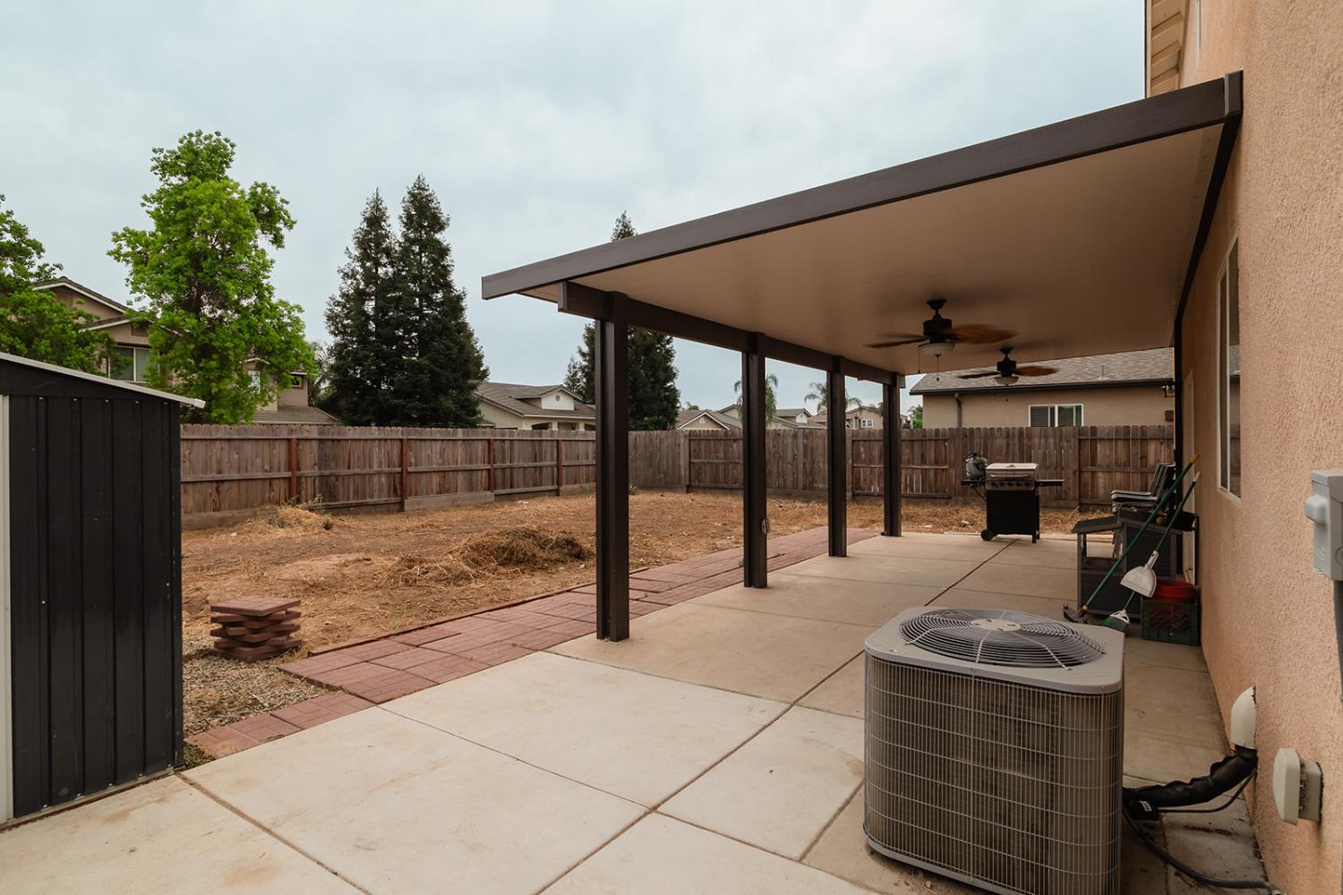 1945 East Gum Avenue Reedley, CA 93654 - Photo 5 of 31 a view of a backyard with sitting area
