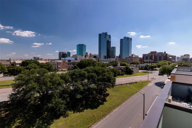 a view of a swimming pool and outdoor seating