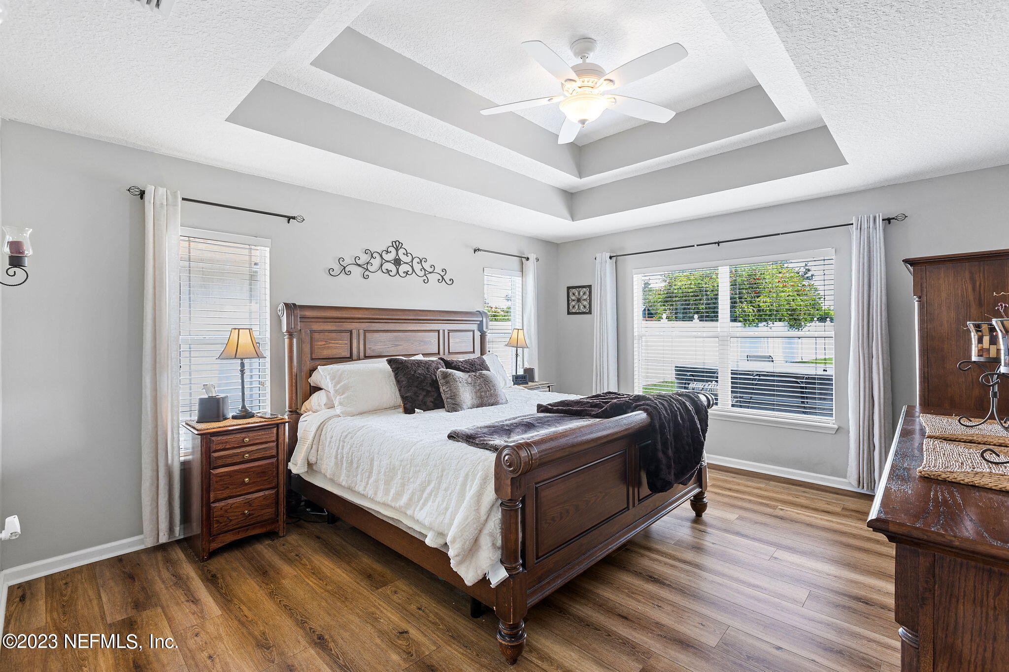293 Porta Rosa Circle St. Augustine, FL 32092 - Photo 13 of 37 a bedroom with a bed and a flat tv screen on dresser