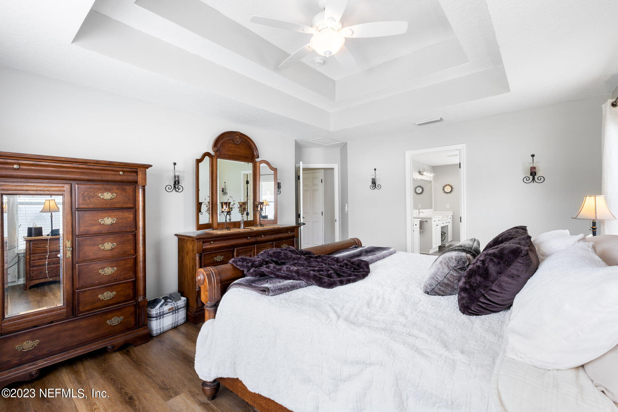 293 Porta Rosa Circle St. Augustine, FL 32092 - Photo 14 of 37 a bedroom with a bed and wooden floor
