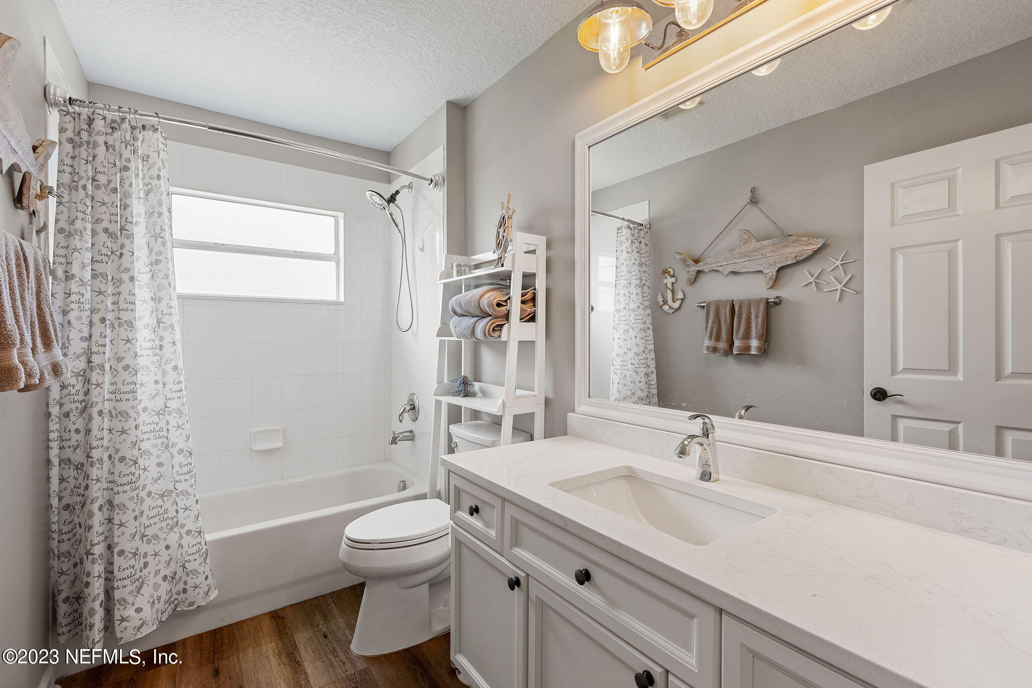 293 Porta Rosa Circle St. Augustine, FL 32092 - Photo 19 of 37 a bathroom with a granite countertop sink toilet a large mirror and shower