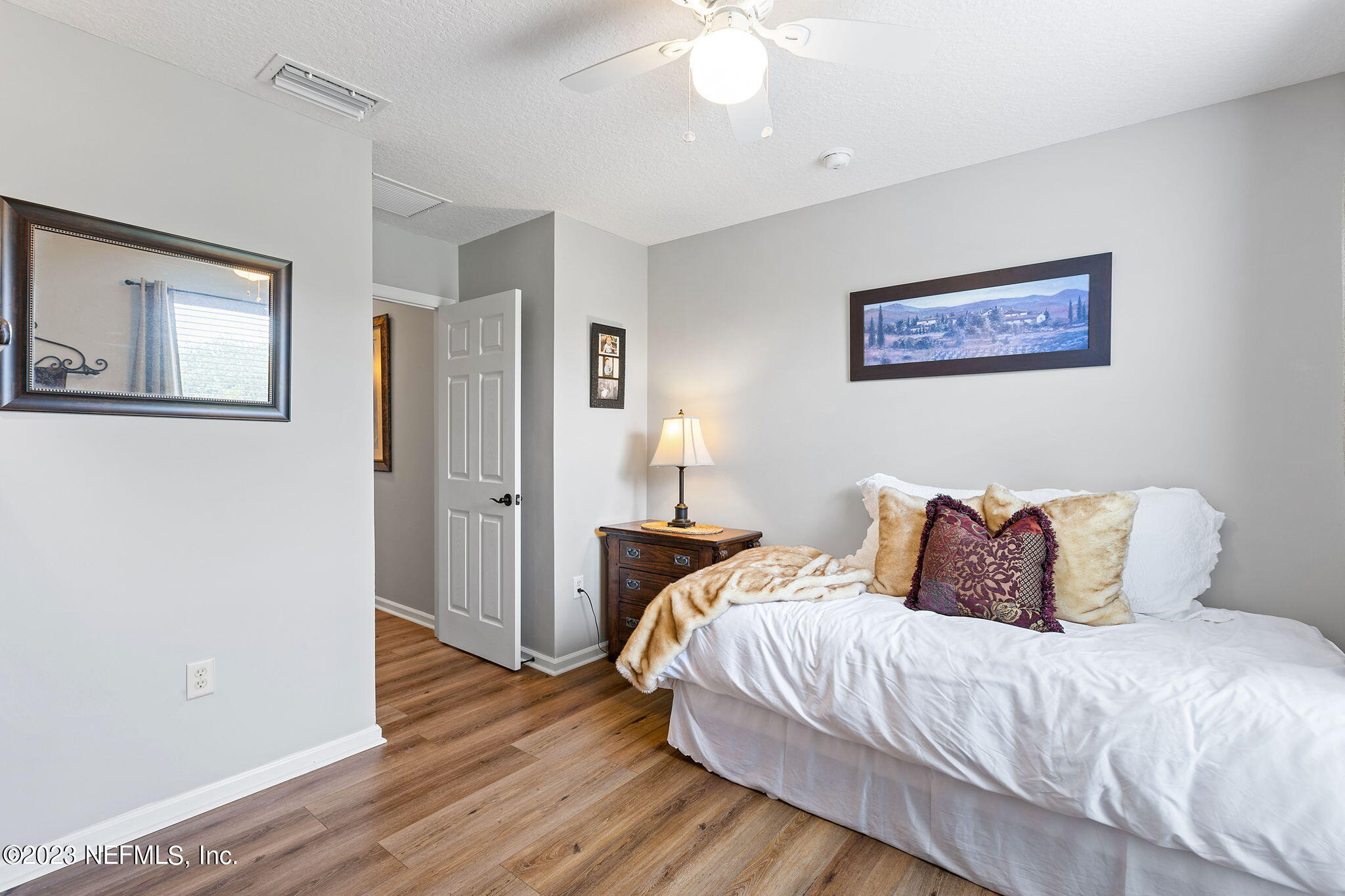 293 Porta Rosa Circle St. Augustine, FL 32092 - Photo 22 of 37 a bedroom with a bed and wooden floor