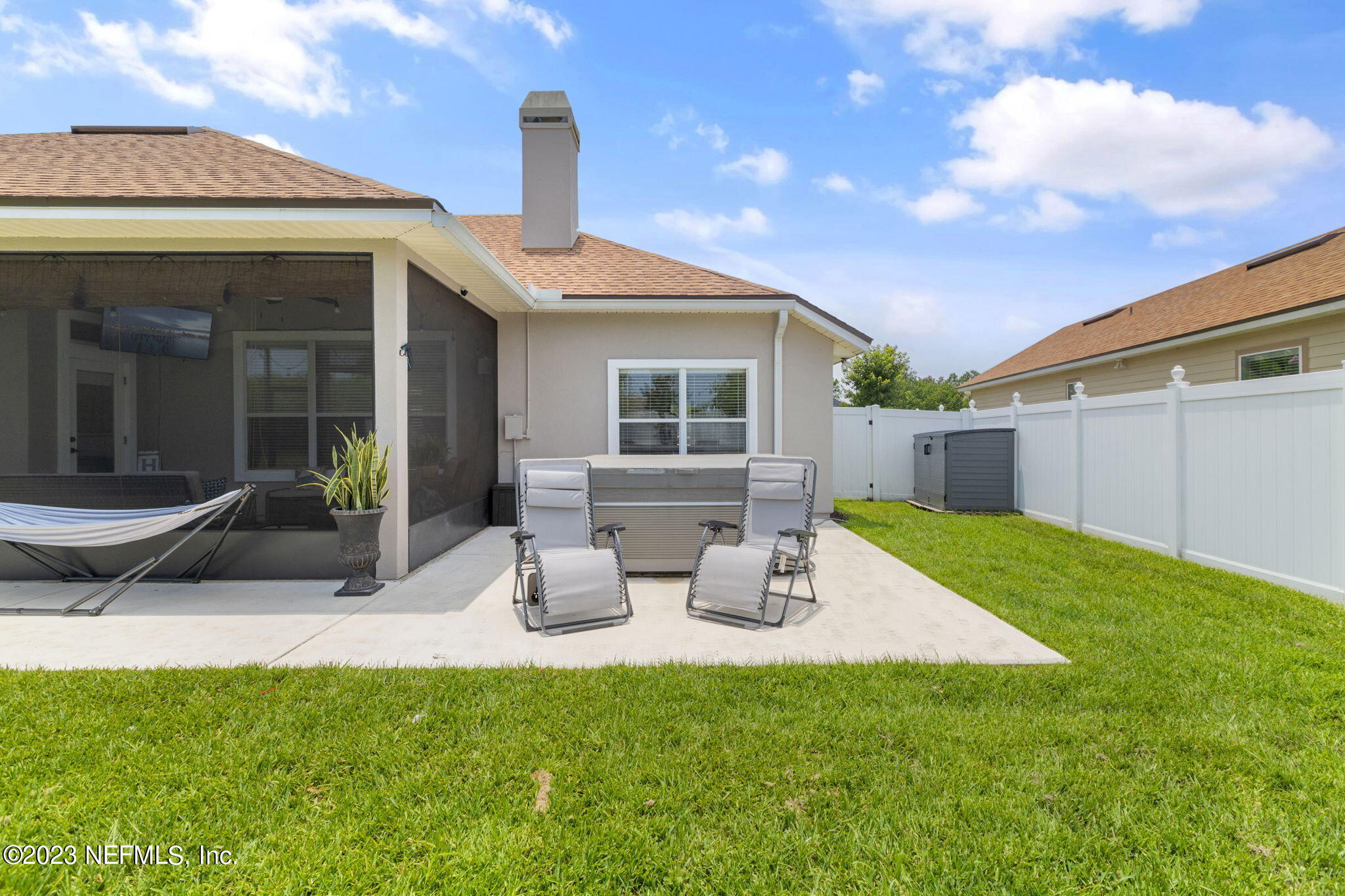 293 Porta Rosa Circle St. Augustine, FL 32092 - Photo 24 of 37 a view of a house with backyard sitting area and garden