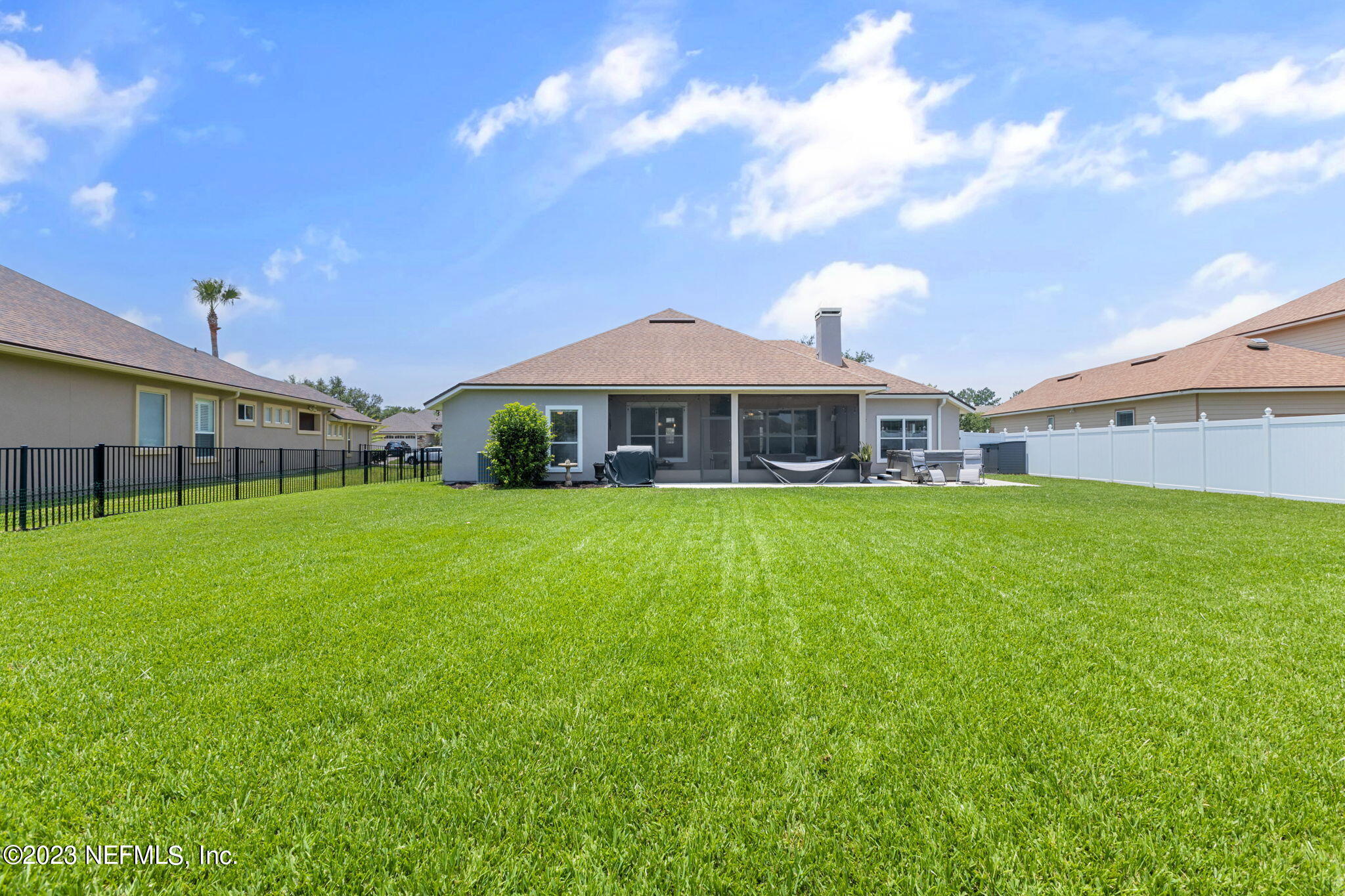 293 Porta Rosa Circle St. Augustine, FL 32092 - Photo 26 of 37 a front view of a house with garden