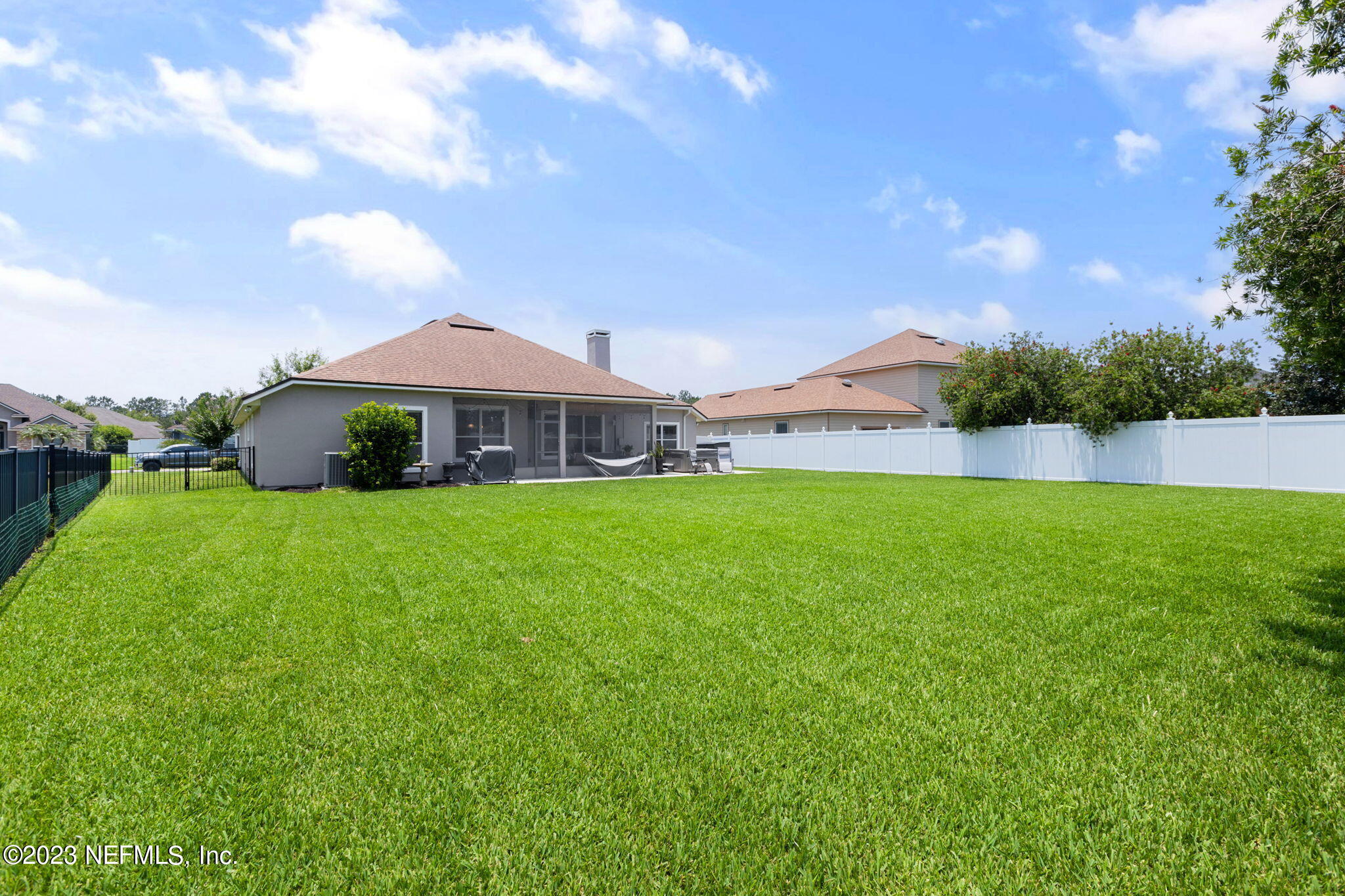 293 Porta Rosa Circle St. Augustine, FL 32092 - Photo 27 of 37 a front view of house with garden