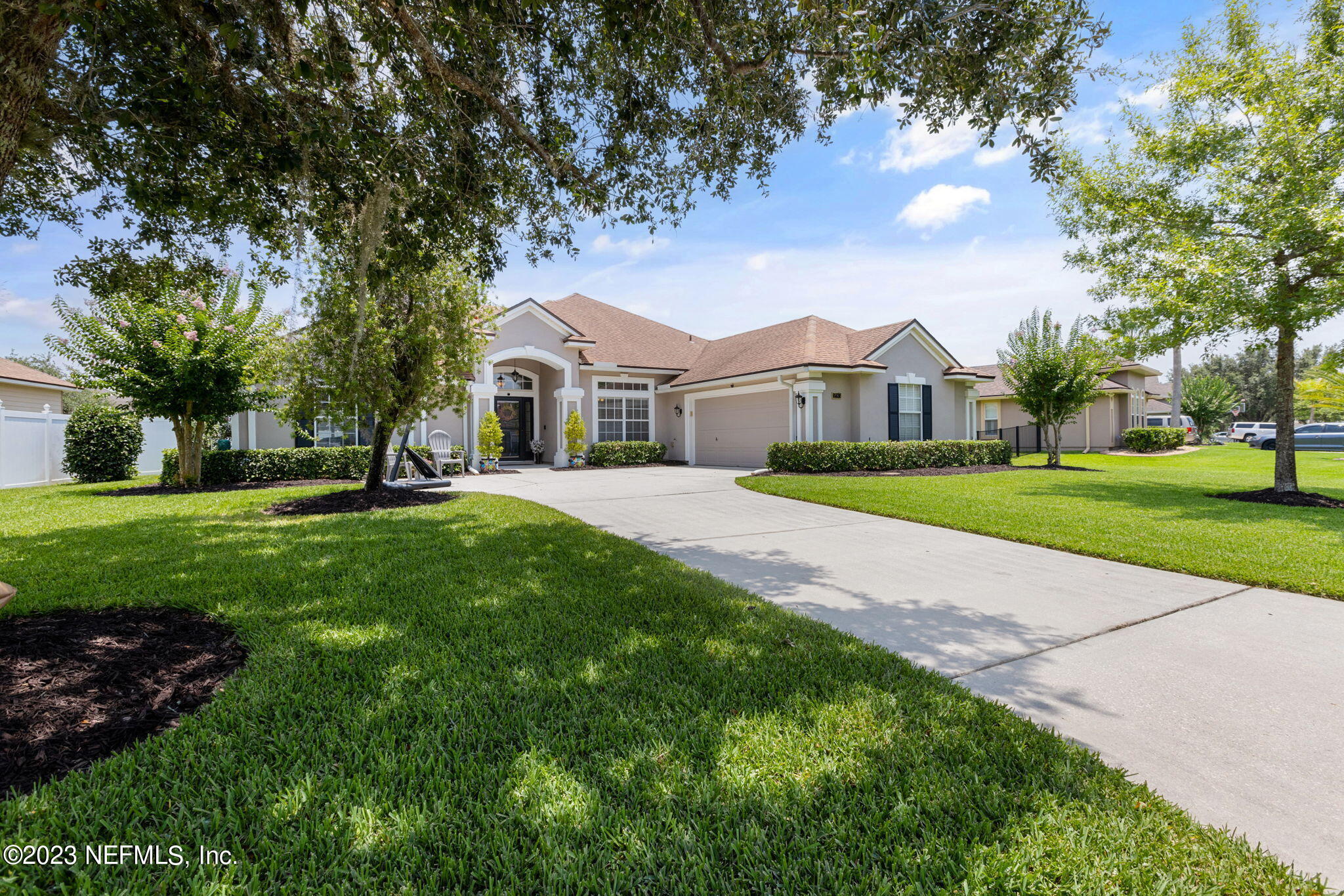 293 Porta Rosa Circle St. Augustine, FL 32092 - Photo 3 of 37 a view of house with a big yard and large trees