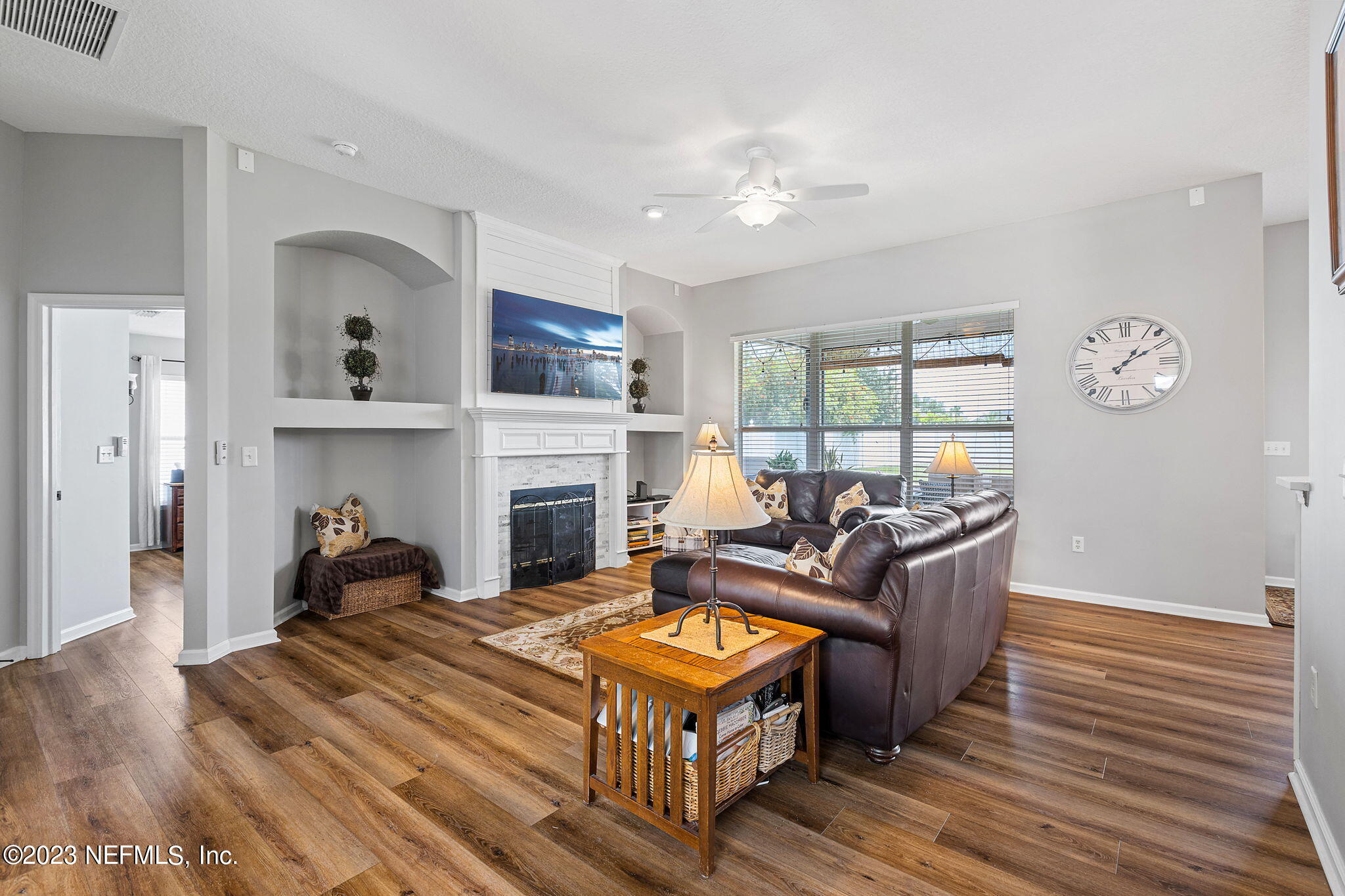 293 Porta Rosa Circle St. Augustine, FL 32092 - Photo 7 of 37 a living room with furniture a fireplace and a window