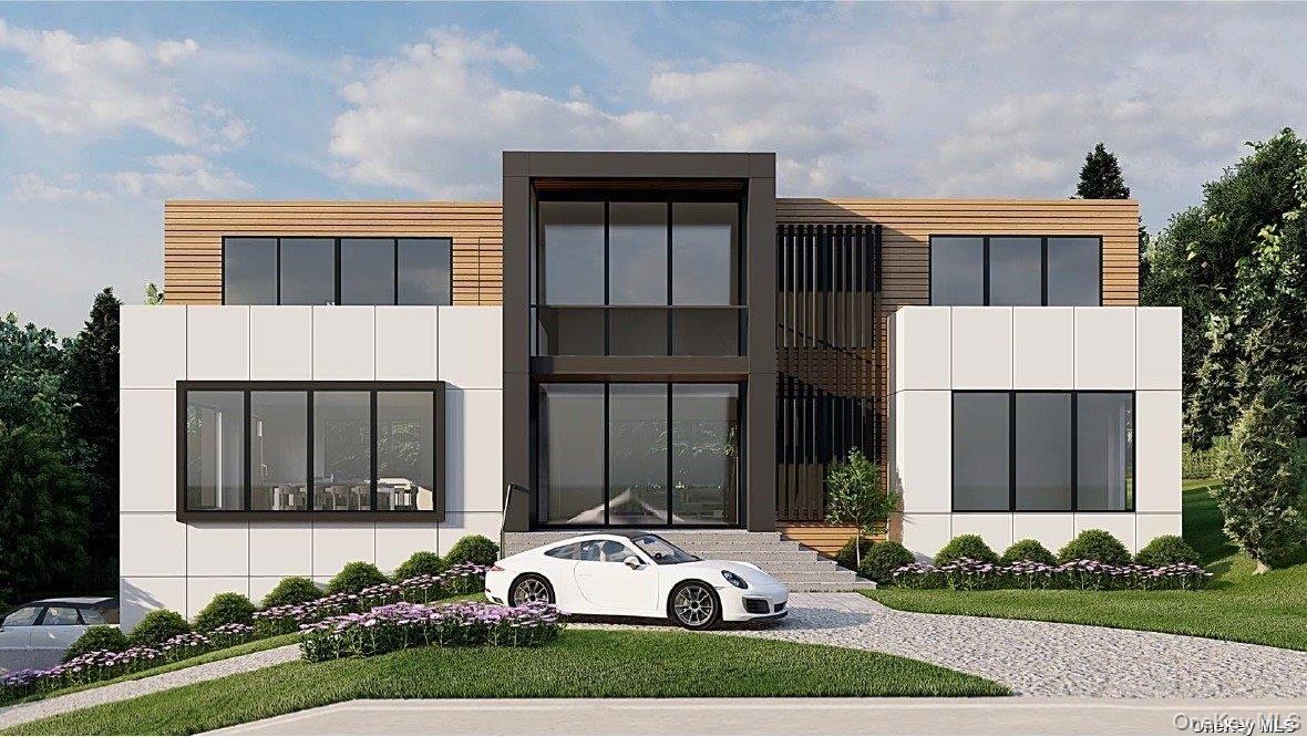 15 Oceanview Drive Southampton, NY 11968 - Photo 2 of 6 a front view of a house with a yard and potted plants