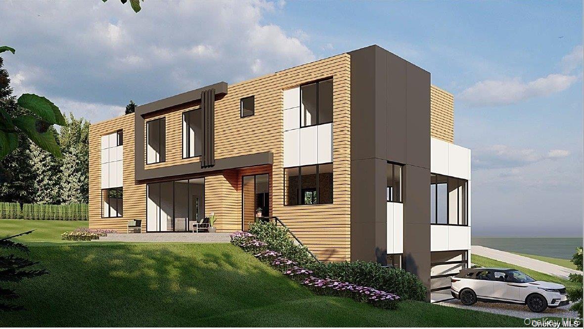 15 Oceanview Drive Southampton, NY 11968 - Photo 4 of 6 a front view of a house with a yard