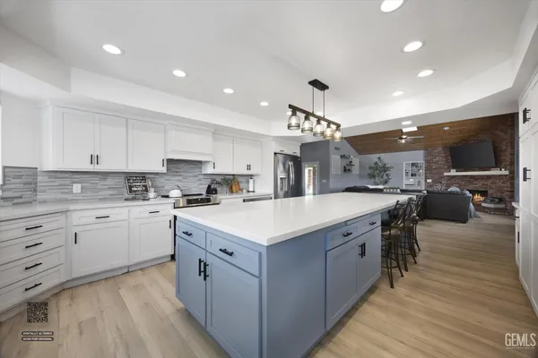 a bathroom with a double vanity sink a mirror and shower