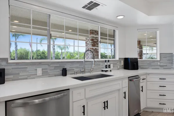 a bed room with a bed and a chandelier