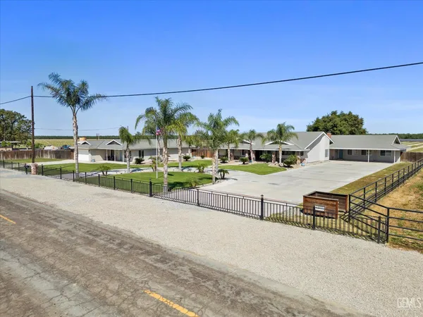 an aerial view of a house with outdoor space