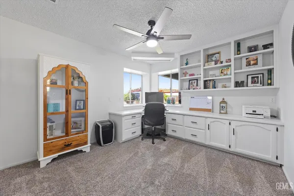 a kitchen with appliances a sink and cabinets