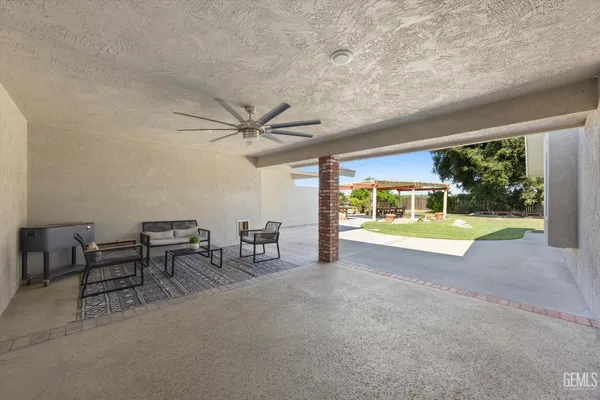 a view of a swimming pool with a patio