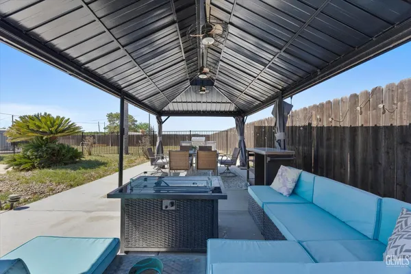 an aerial view of a house with yard swimming pool and outdoor seating