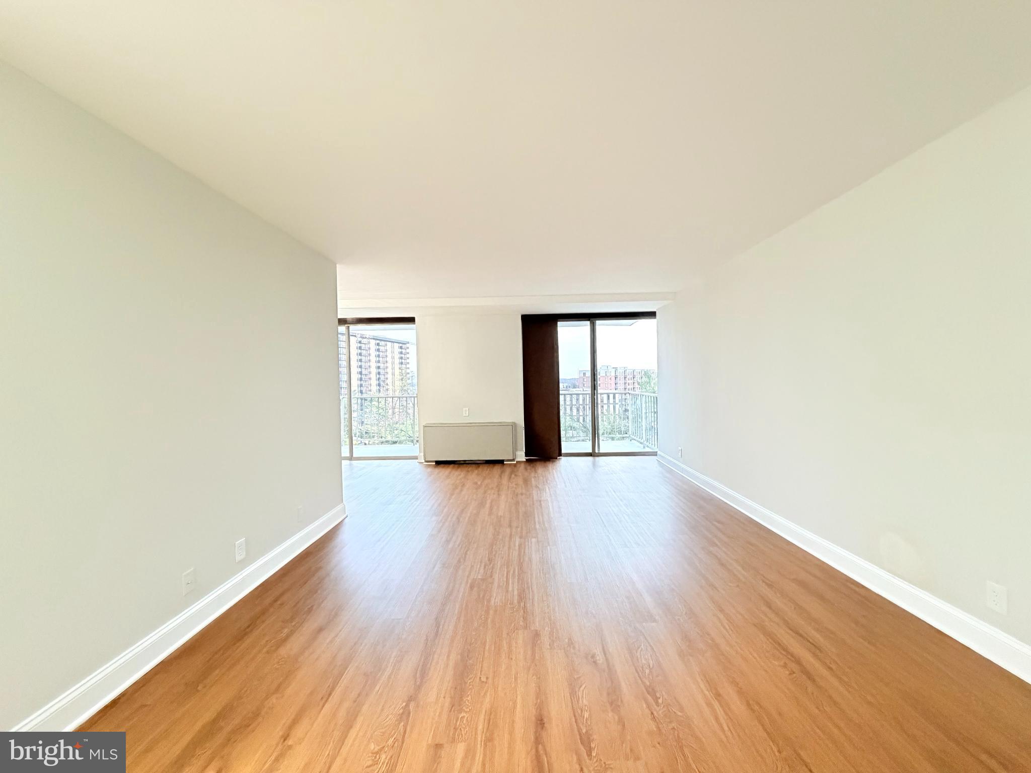 301 North Beauregard Street, Unit 703 Alexandria, VA 22312 - Photo 2 of 16 a view of wooden floor and windows in an empty room