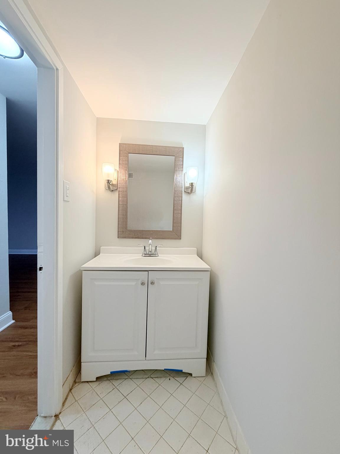 301 North Beauregard Street, Unit 703 Alexandria, VA 22312 - Photo 10 of 16 a utility room with a sink and a mirror
