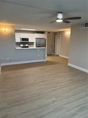 a view of a kitchen with a sink