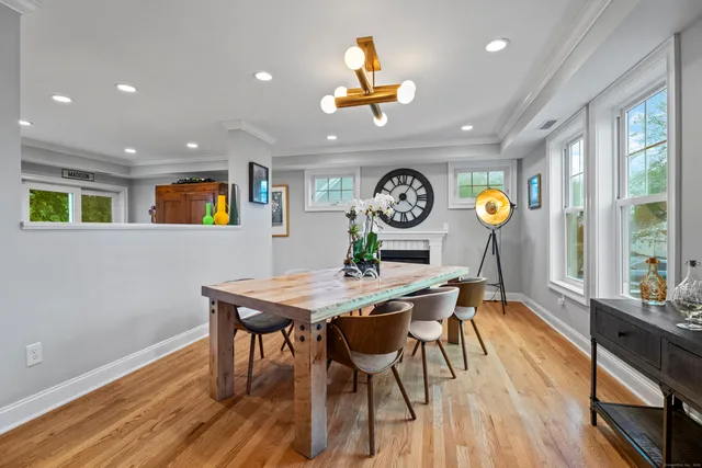 a view of a dining room with a table and chairs