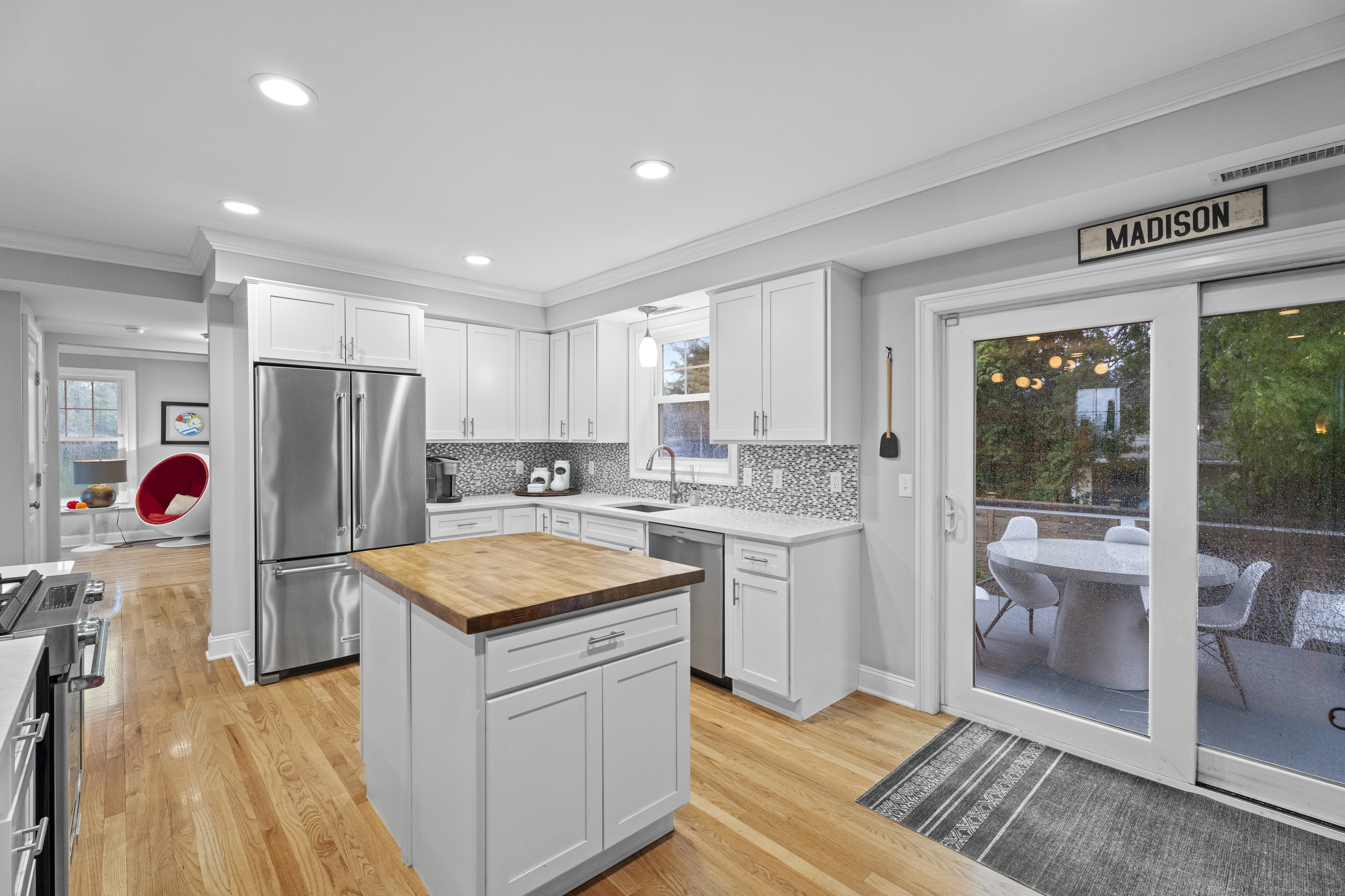 3 Arrowhead Road Madison, CT 06443 - Photo 12 of 40 a kitchen with refrigerator cabinets and wooden floor