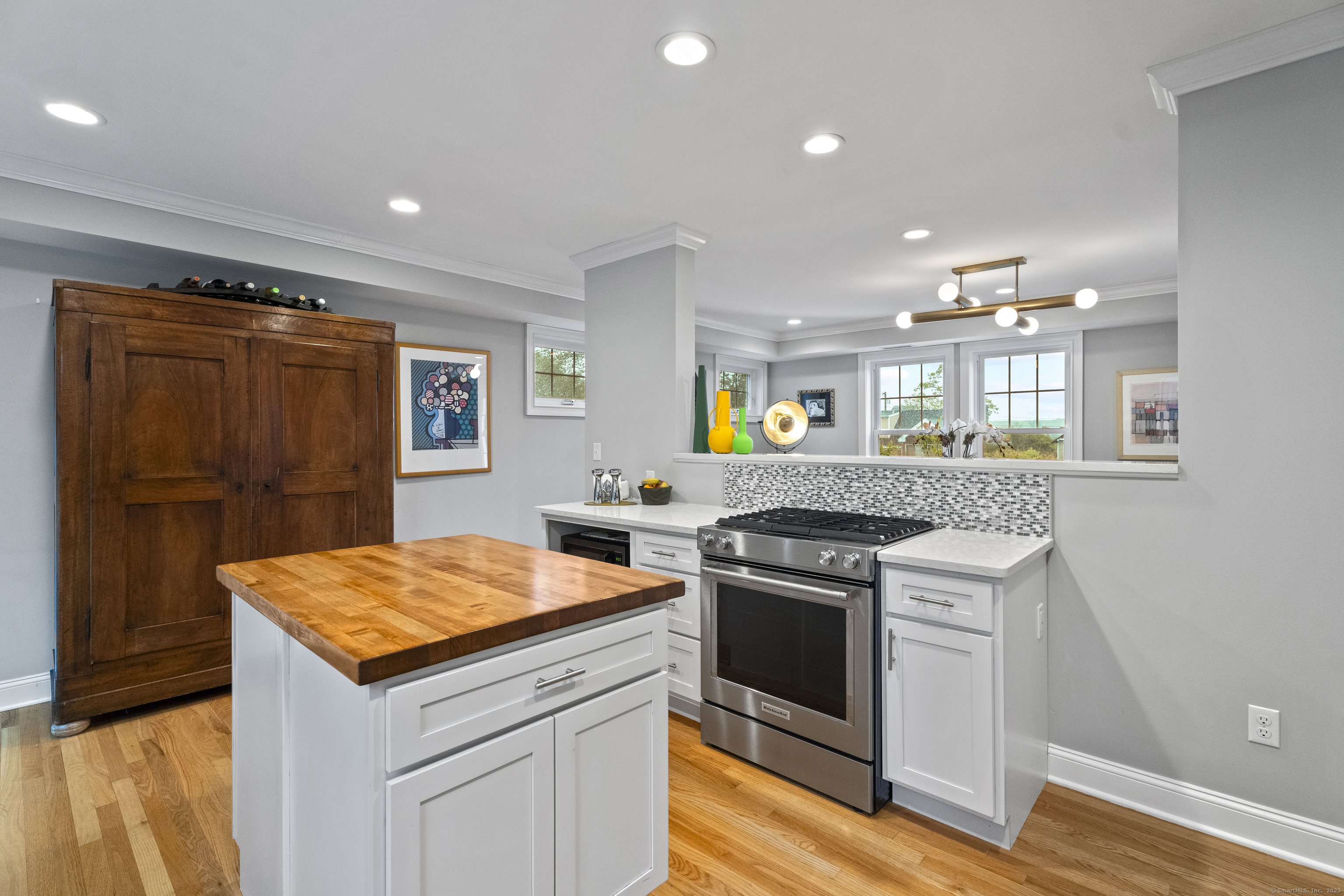 3 Arrowhead Road Madison, CT 06443 - Photo 15 of 40 a kitchen with a stove a sink and a refrigerator