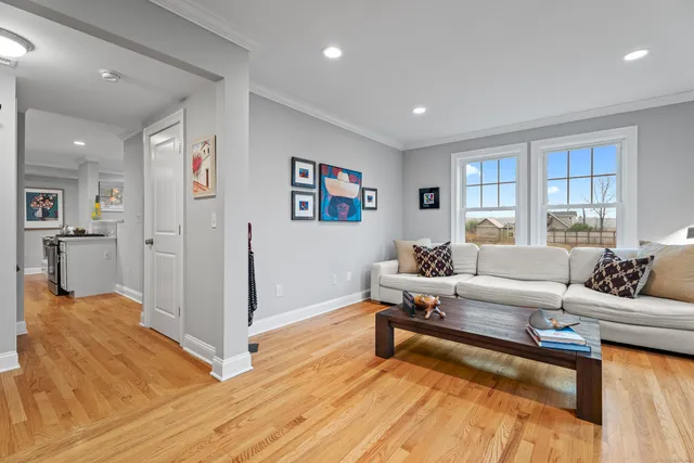 a living room with furniture and a rug