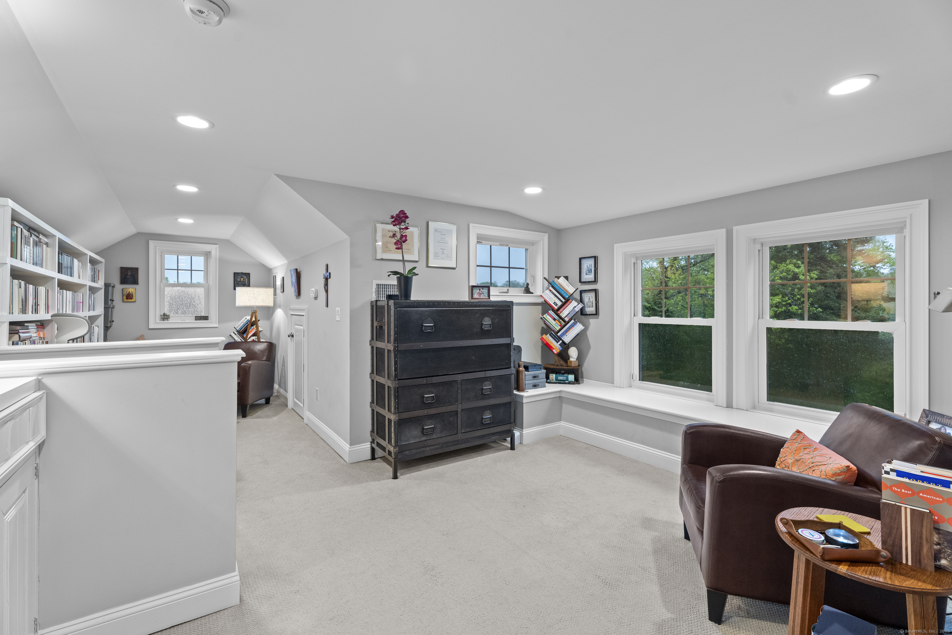 3 Arrowhead Road Madison, CT 06443 - Photo 20 of 40 a living room with furniture and a large window