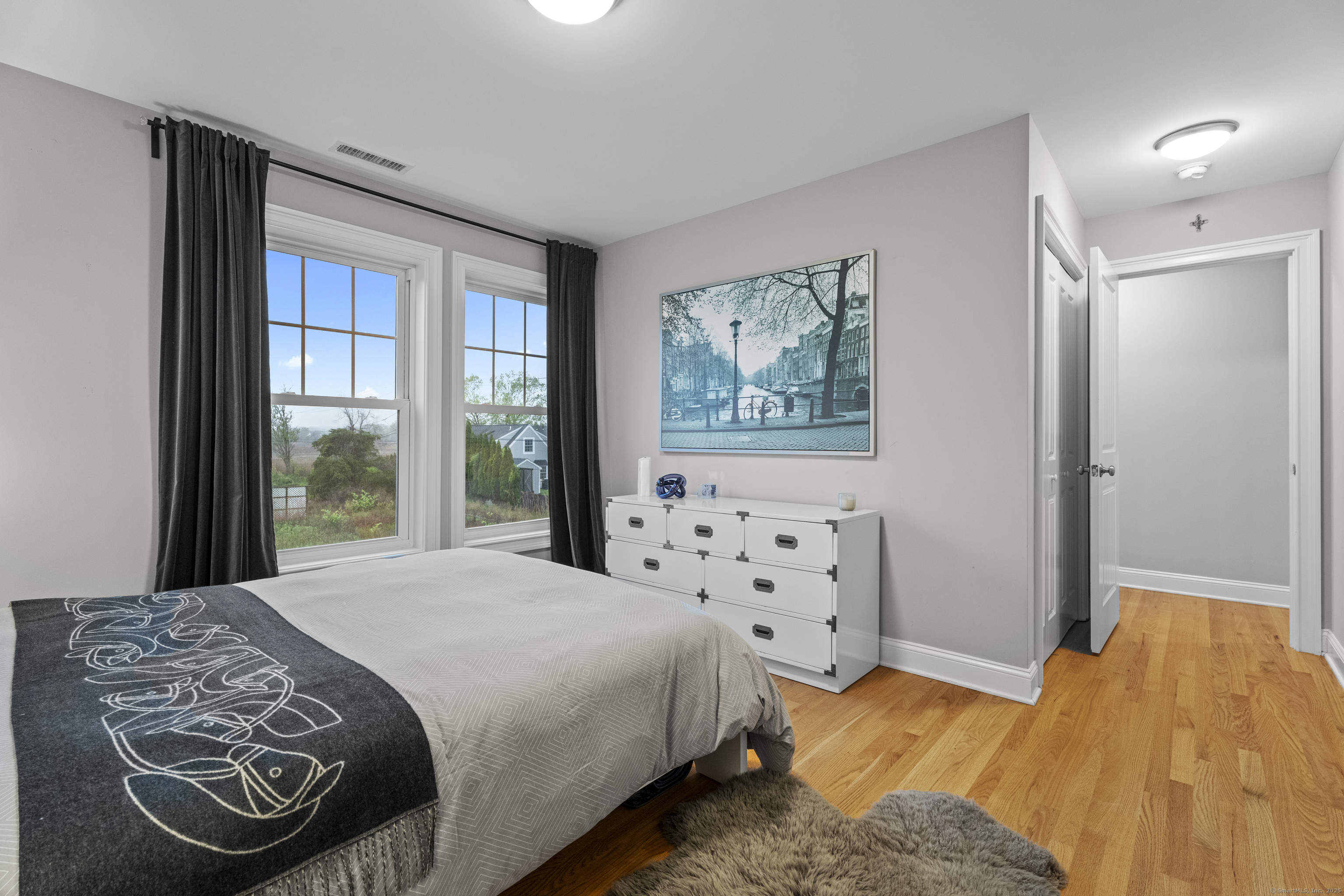 3 Arrowhead Road Madison, CT 06443 - Photo 25 of 40 a bedroom with a bed and a window