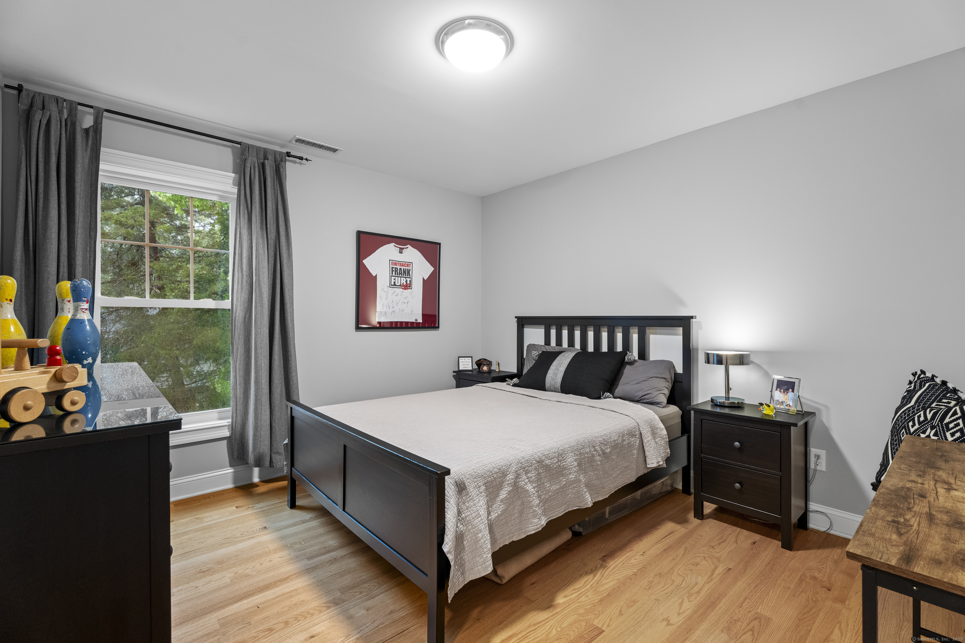 3 Arrowhead Road Madison, CT 06443 - Photo 26 of 40 a bedroom with a bed and a table