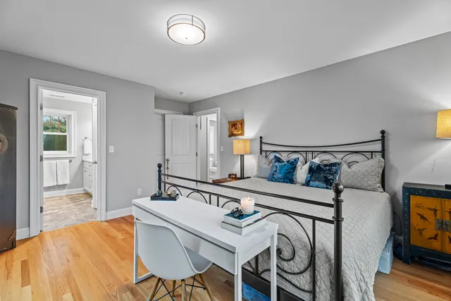 a bedroom with a bed and a table in it