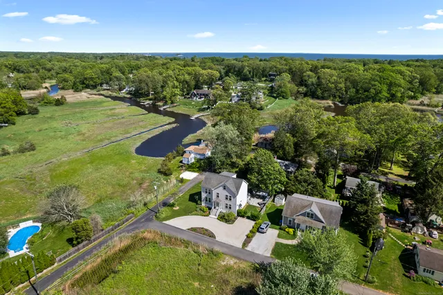 an aerial view of residential houses with outdoor space