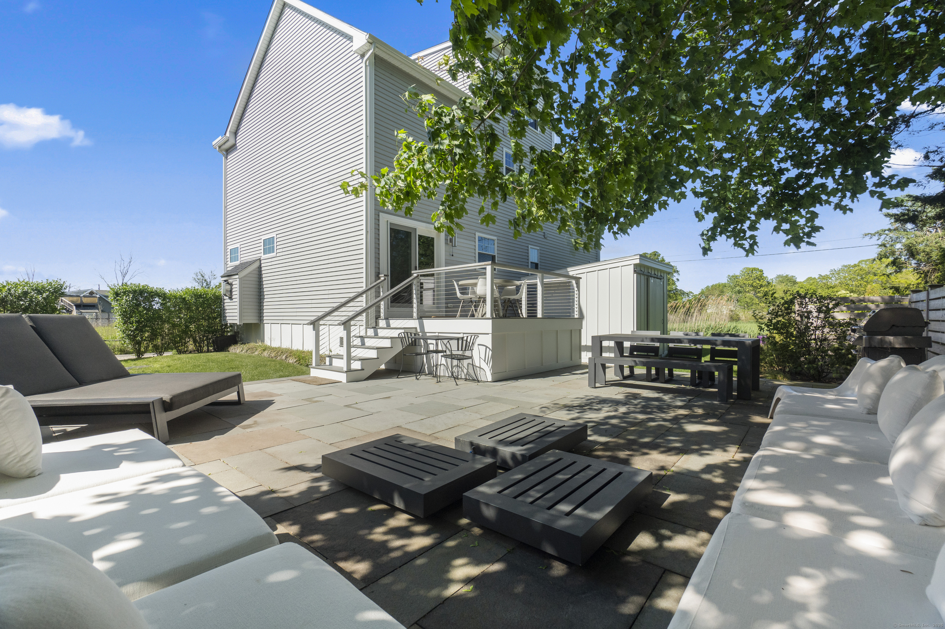 3 Arrowhead Road Madison, CT 06443 - Photo 6 of 40 a view of backyard of house with seating area