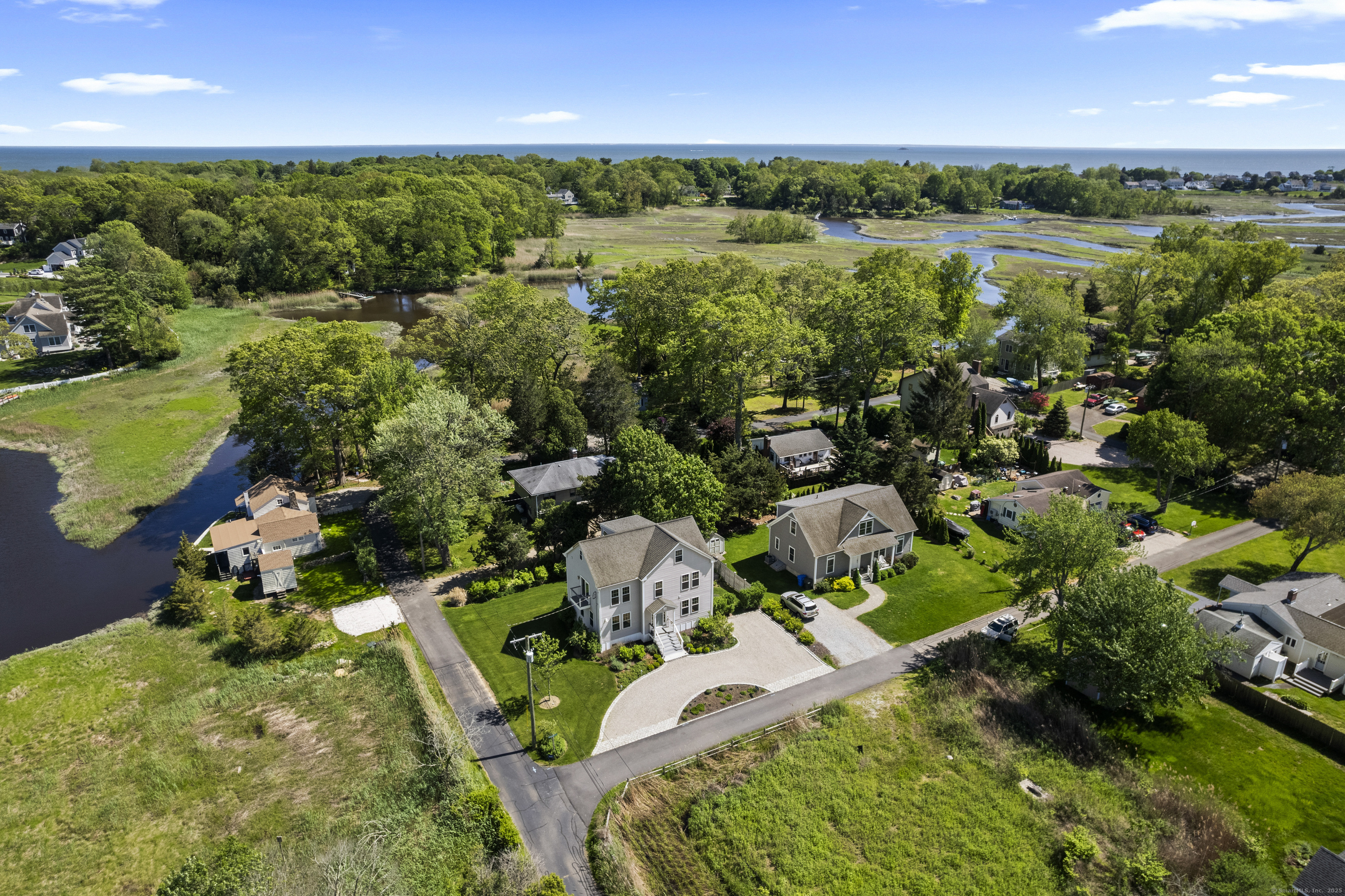 3 Arrowhead Road Madison, CT 06443 - Photo 8 of 40 an aerial view of a house with a yard and lake view