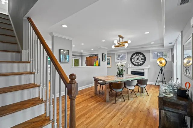 a living room with furniture and a clock
