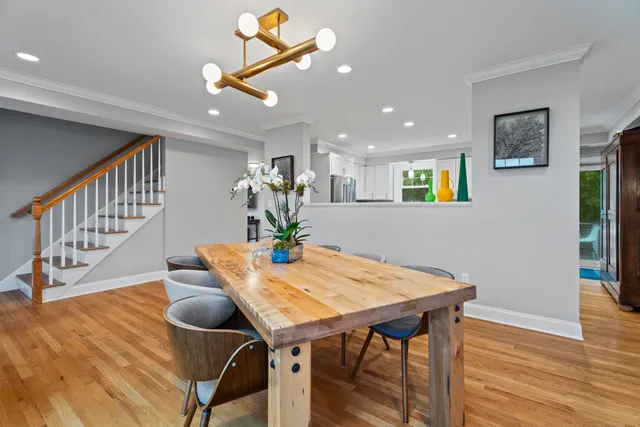a view of a dining room with furniture and wooden floor