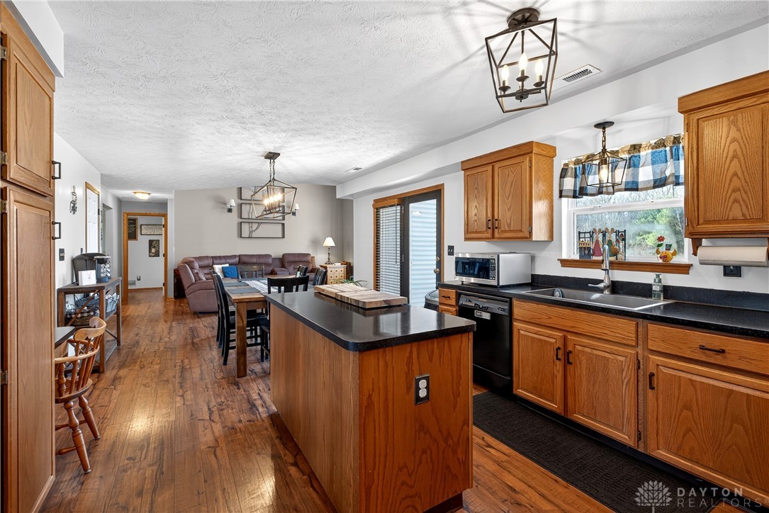 6560 Snyder Road Fletcher, OH 45326 - Photo 24 of 71 This open concept kitchen and dining area features abundant natural light and hardwood floors.