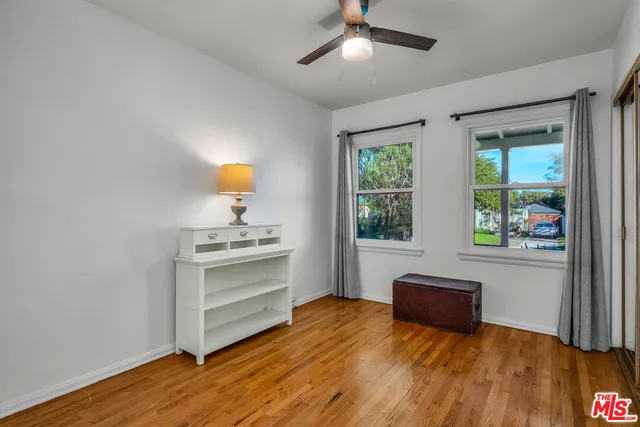 a bed room with a bed and a window