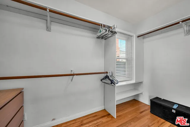 a bathroom with a shower sink vanity and mirror