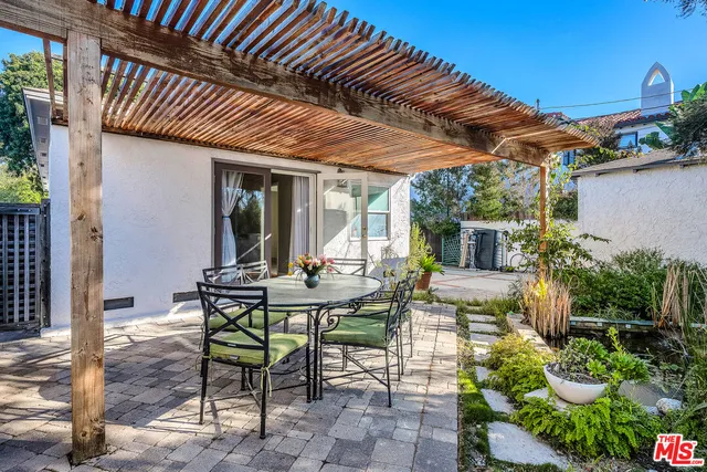 a view of a backyard with sitting area