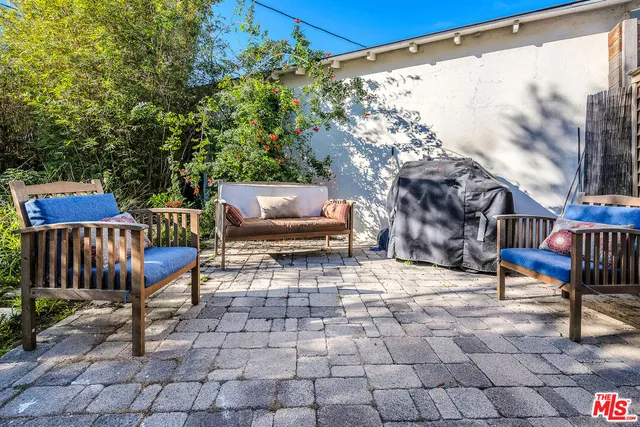 a view of swimming pool with sitting area
